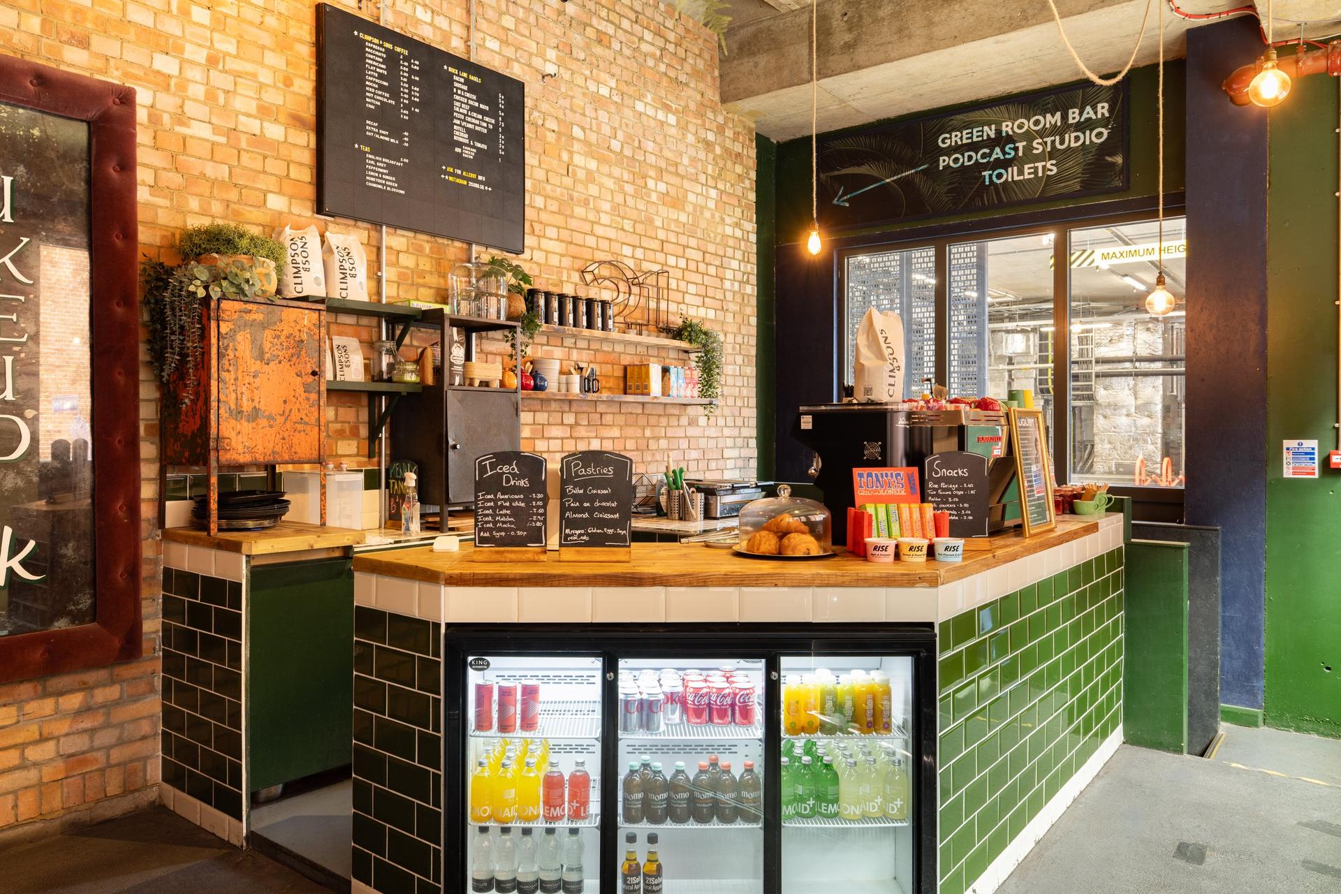 The café counter at 21Soho, with the board menu and pastries