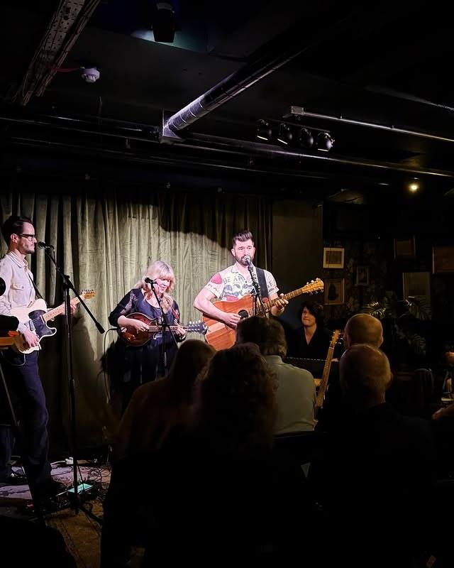 A band playing to a seated audience in the Green Room at 21Soho