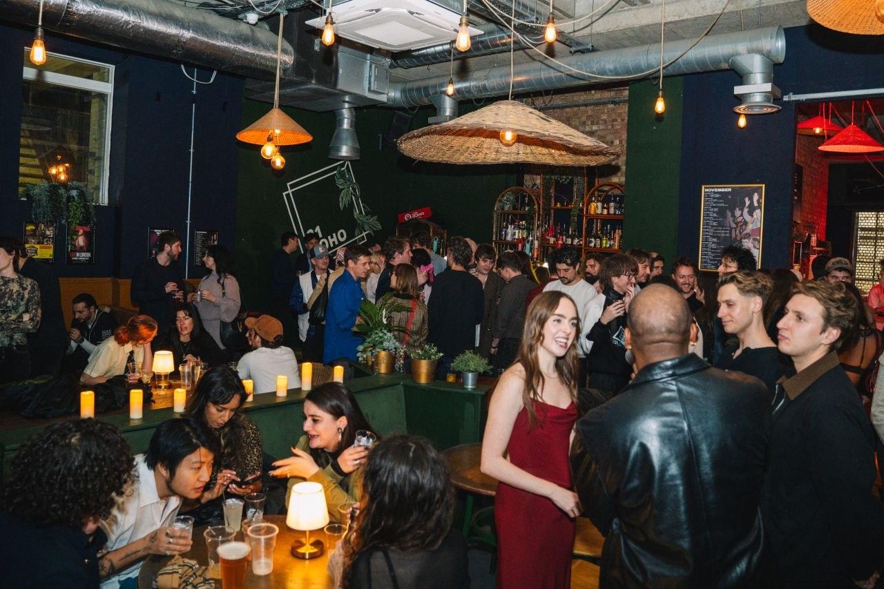 A busy evening at 21Soho, with people drinking at the tables and the bar